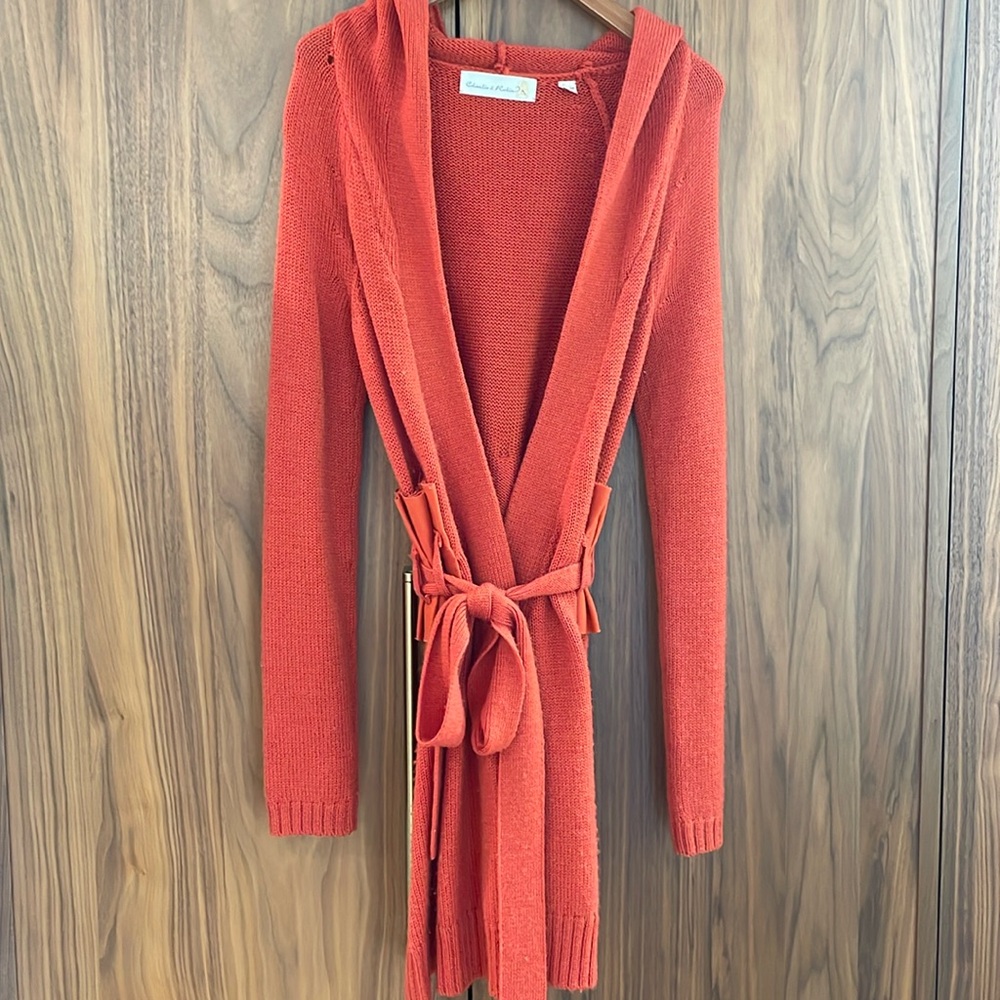 Unique mid-2000’s sweater coat in fun red orange color with waist detailing.